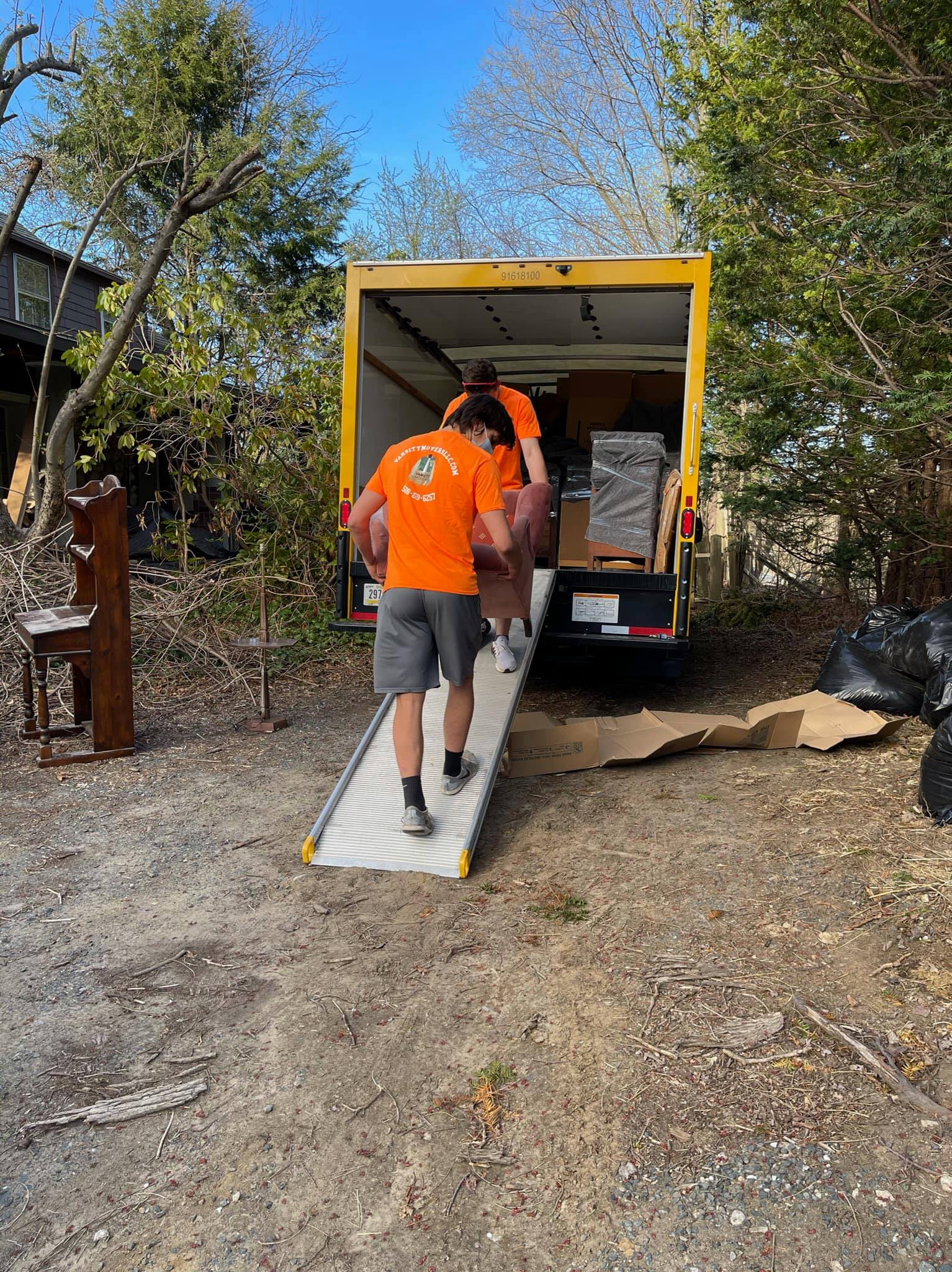 An image of Varsity Movers LLC unloading the truck.